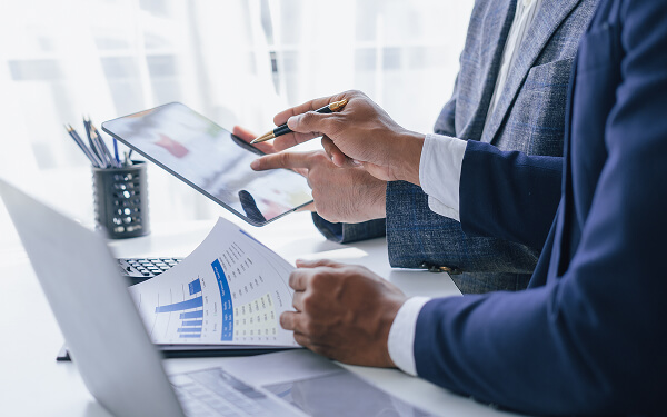 Two people looking over tax planning documents