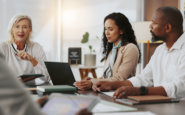 Tax professional discusses finances with clients