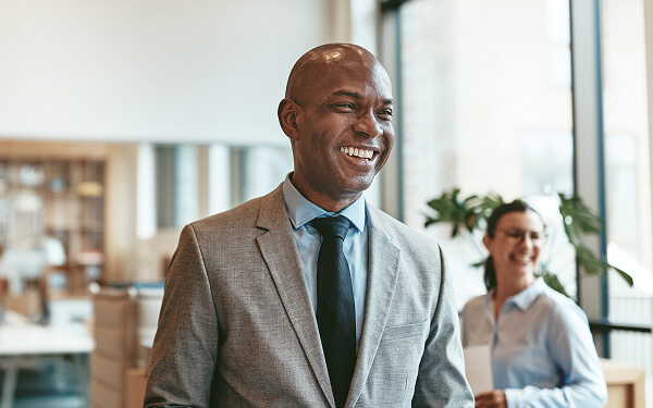 Tax professional smiling welcoming client.